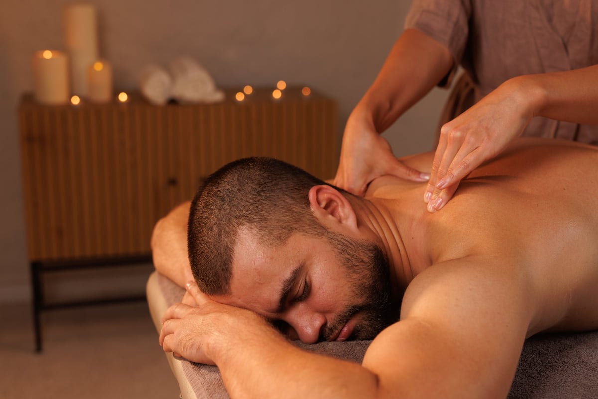 Relaxing neck massage, healthy massaging rehab concept. Close-up hands of masseur doing wellness medical relaxing massage for patient